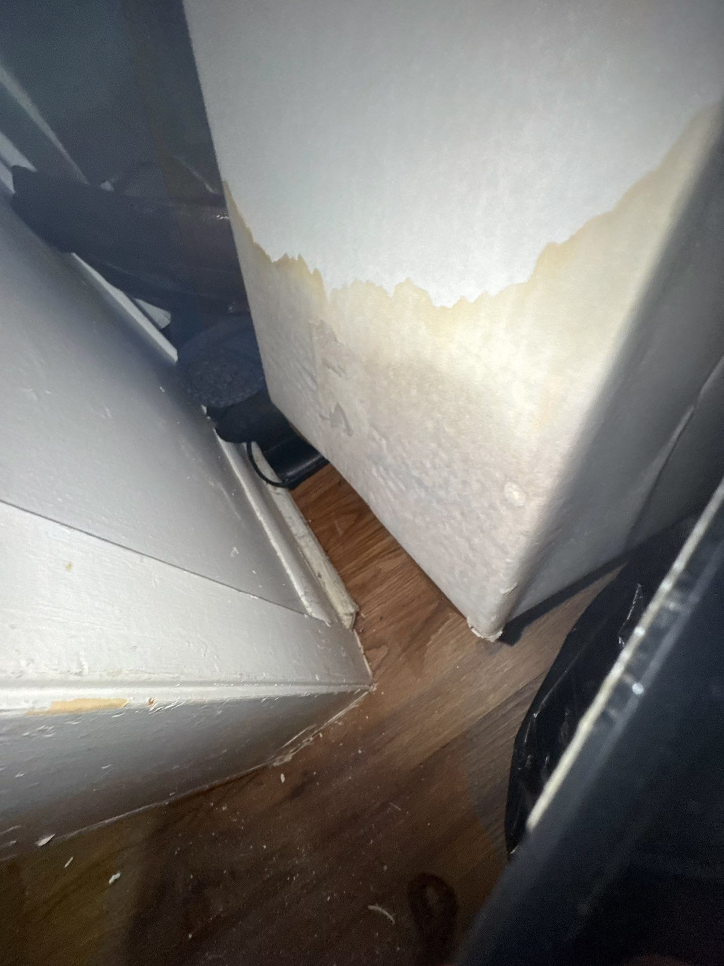 Water line visible on the side of an appliance from ongoing leak