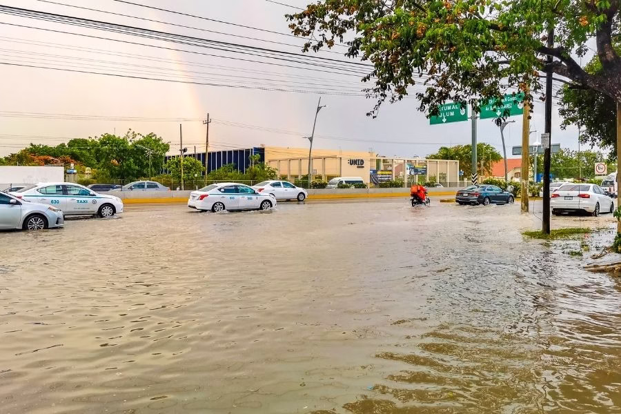 Flooded Austin street with stranded vehicles during severe spring storm