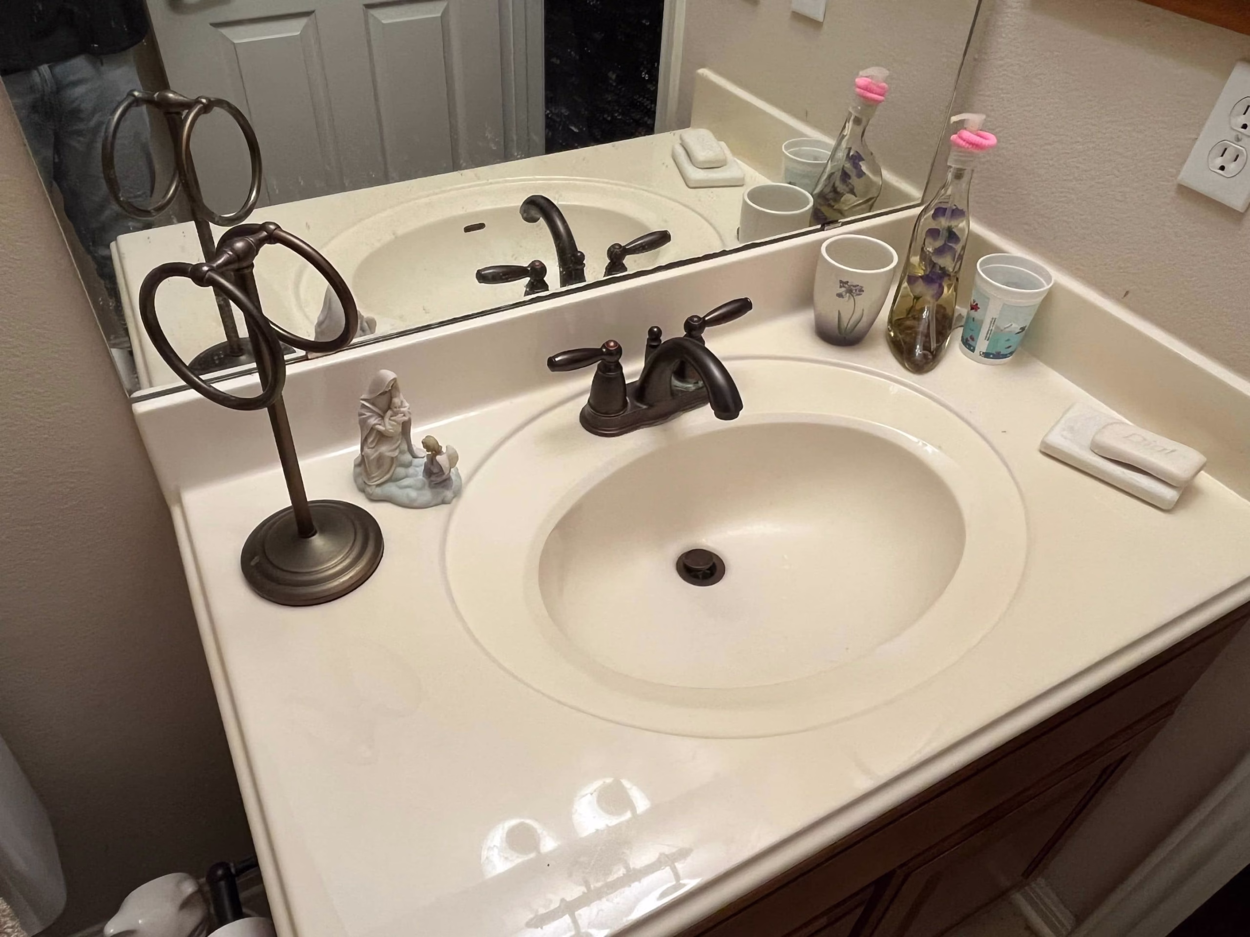 Restored bathroom sink and cabinet after complete mold remediation and rebuild